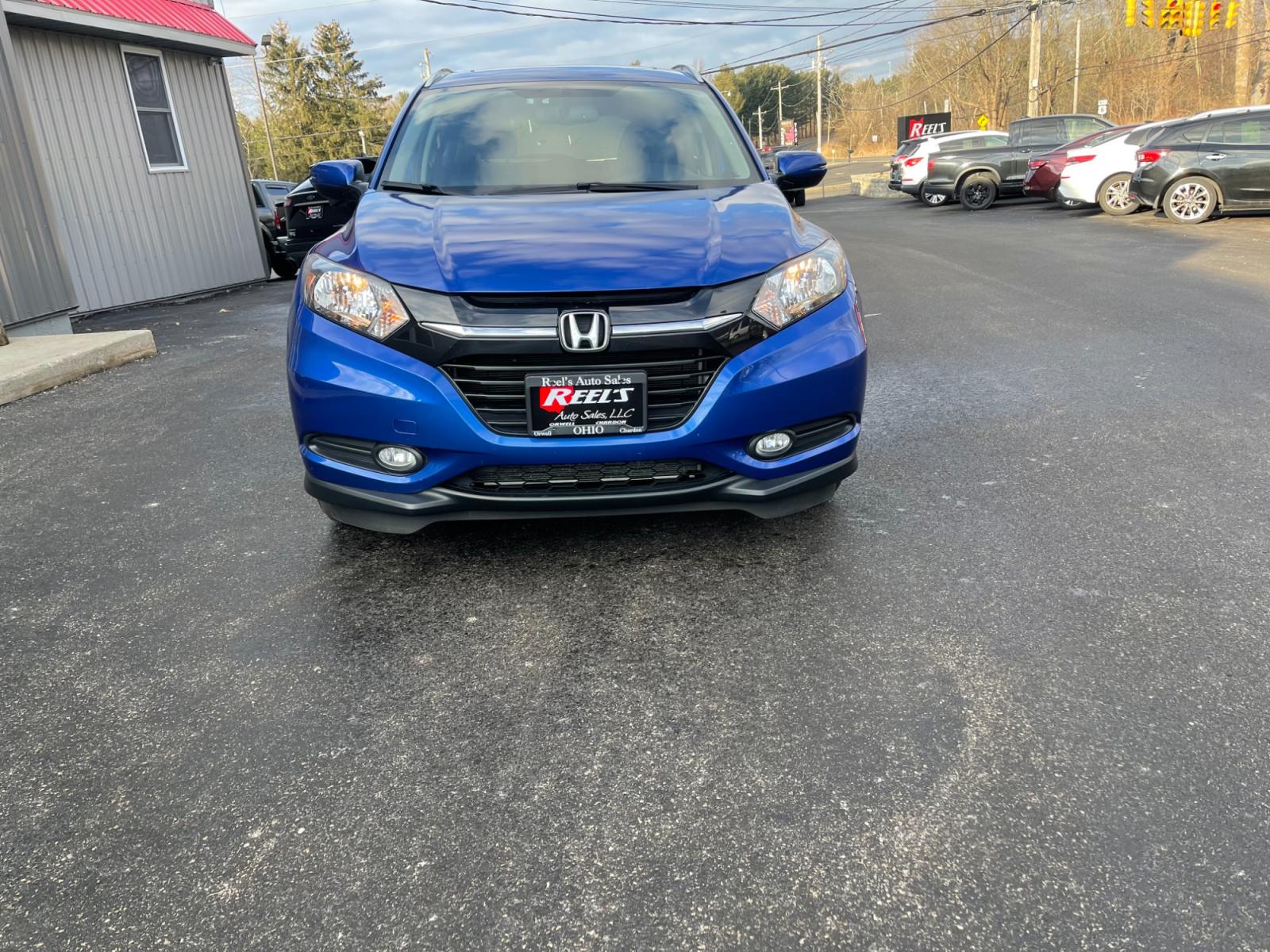 2018 Blue /Black Honda HR-V EX-L w/Navigation 4WD CVT (3CZRU6H71JM) with an 1.8L I4 DOHC 16V engine, Automatic transmission, located at 11115 Chardon Rd. , Chardon, OH, 44024, (440) 214-9705, 41.580246, -81.241943 - This 2018 Honda HR-V equipped with AWD (All Wheel Drive) and a 1.8L engine paired with a CVT (Continuously Variable Transmission) offers a blend of performance and efficiency. Its luxurious leather interior, complemented by heated seats and an automatic climate control system, ensures a comfortable - Photo #1